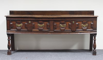 Lot 689 - An 18th Century oak dresser fitted two drawers...