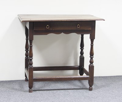 Lot 697 - An 18th Century oak side table fitted a drawer,...