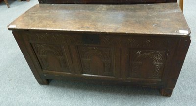 Lot 698 - An oak coffer with carved front, 108cm wide