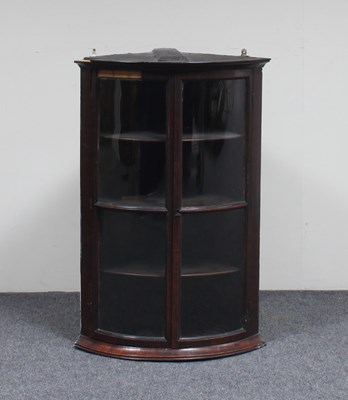 Lot 716 - A Georgian mahogany bowfront corner cupboard...