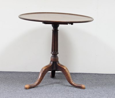 Lot 720 - A Georgian mahogany supper table, the dished...