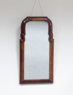 Lot 730 - A walnut cushion framed mirror, possibly Dutch,...