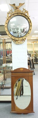 Lot 738 - A Regency style convex mirror with eagle...