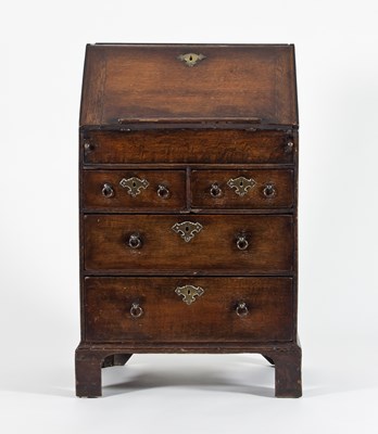 Lot 746 - An early 18th Century narrow oak bureau, the...