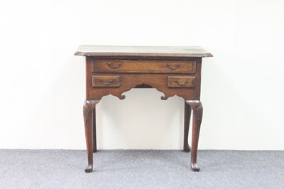 Lot 751 - An 18th Century oak and inlaid lowboy, fitted...