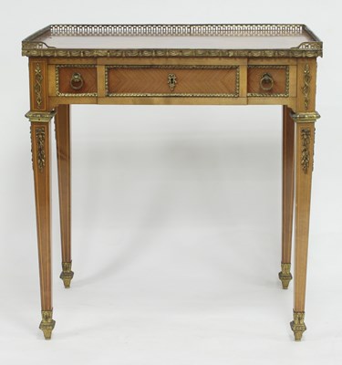 Lot 761 - A Louis XVI style inlaid side table, the three-...