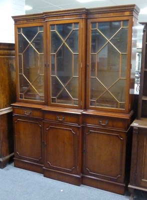 Lot 762 - A reproduction library bookcase of breakfront...