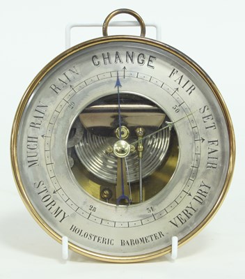 Lot 842 - A circular holosteric barometer in a brass...