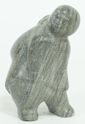 Lot 865 - An Inuit stone carving of a mother carrying a...