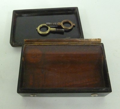 Lot 870 - A pressed tortoiseshell cased music box, the...