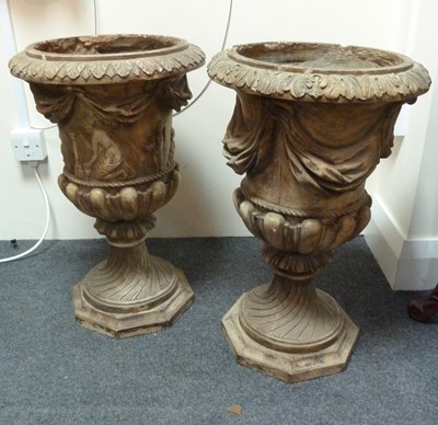 Lot 872 - Two 19th Century plaster urns, part gadrooned...