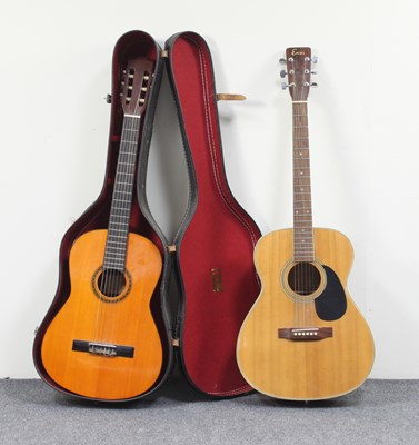 Lot 890 - A Harmony six-string acoustic guitar, an...