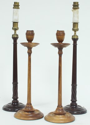 Lot 907 - A pair of turned wood candlesticks and another...