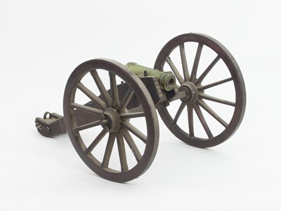 Lot 941 - A model cannon, the bronze barrel mounted on a...