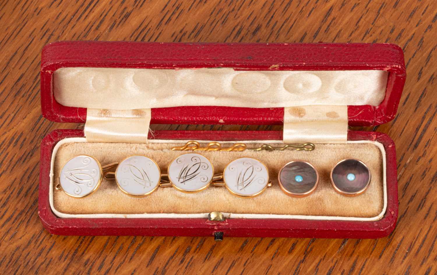 Lot 87 - A set of four 18ct gold and mother-of-pearl dress studs