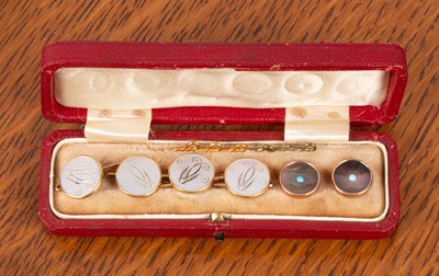 Lot 87 - A set of four 18ct gold and mother-of-pearl dress studs