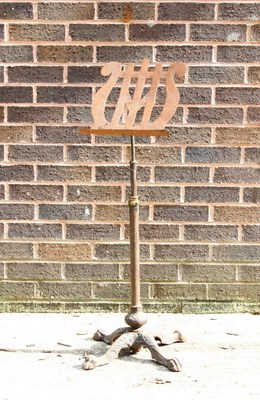 Lot 42 - An iron music stand with lyre-shaped rest,...