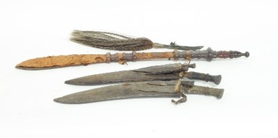 Lot 58 - An North African tribal sword with leather...