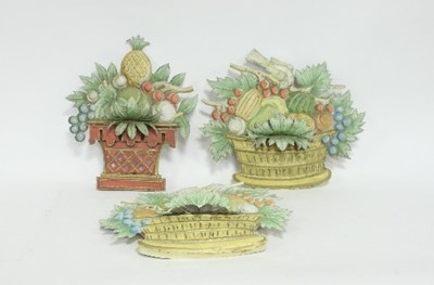 Lot 72 - Three painted tin wall appliques, modelled as...