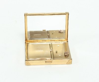 Lot 73 - A Swiss musical compact, the hinged cover...