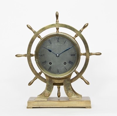 Lot 96 - A brass ship's wheel mantel clock, the...