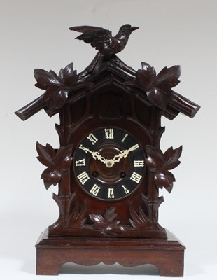 Lot 102 - A Black Forest pine cased mantel cuckoo clock,...