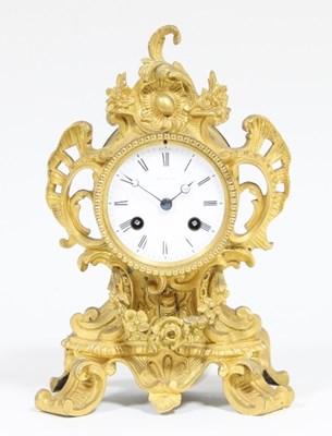 Lot 104 - A French ormolu mantel clock, the enamel dial...