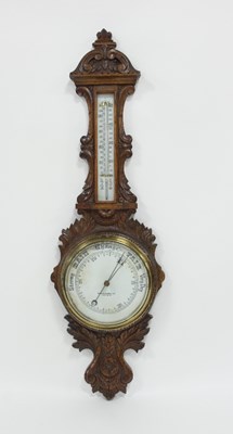 Lot 110 - An aneroid barometer and thermometer, in a...