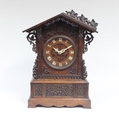 Lot 113 - An oak cased Black Forest cuckoo clock, the...