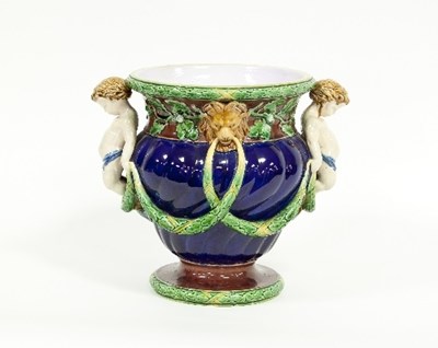 Lot 152 - A Minton majolica jardiniere with putti in...