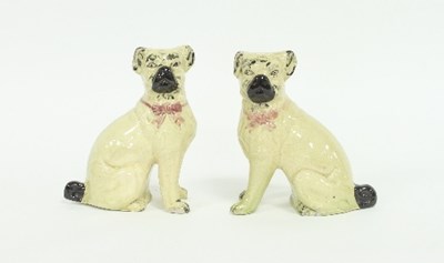 Lot 154 - A pair of earthenware models of seated pug...