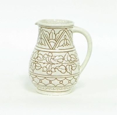 Lot 165 - A Bursley Ware jug by Charlotte Rhead, etched...