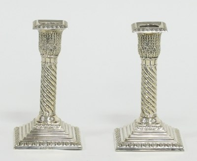 Lot 188 - A pair of silver plated candlesticks, each...