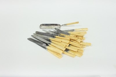 Lot 206 - A set of steel cutlery with reeded ivory...