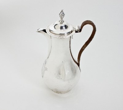 Lot 220 - A George III silver hot water jug, Charles...