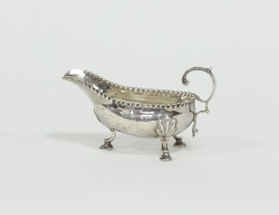 Lot 222 - A George III silver sauce boat, London 1783,...