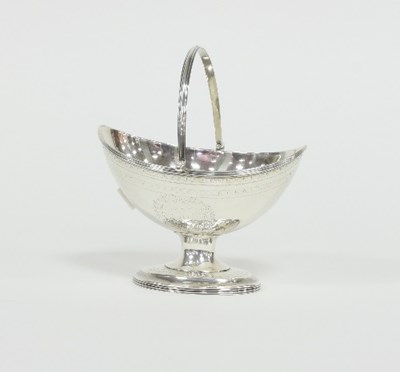 Lot 225 - A George III silver swing handled basket,...