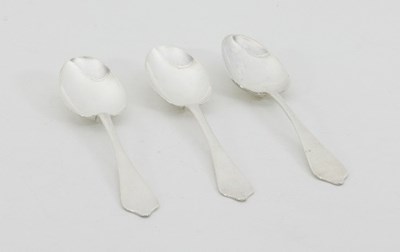 Lot 311 - Three similar Georgian silver dog-nose spoons,...