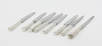 Lot 314 - A set of eight silver handled table knives,...