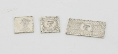 Lot 328 - Three silver replica postage stamps, London...