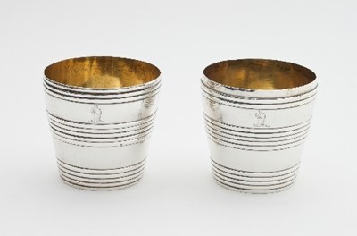 Lot 335 - A pair of George III silver beakers, Charles...