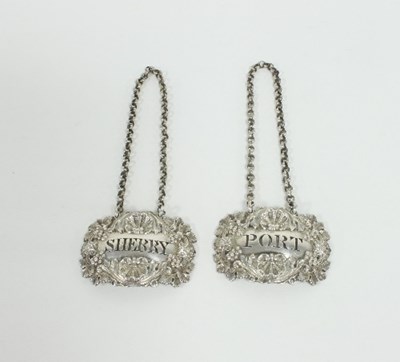 Lot 368 - A pair of William IV cast silver wine labels,...