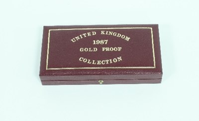 Lot 381 - The 1987 UK gold proof three-coin set, no...