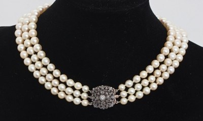 Lot 404 - A three-row cultured pearl necklace with...