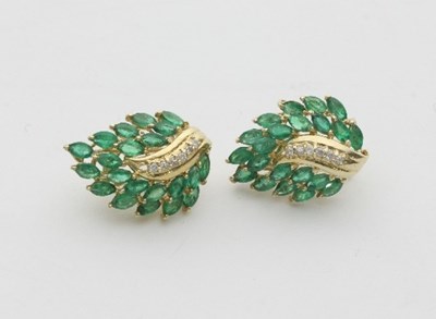 Lot 437 - A pair of emerald and diamond ear clips, of...