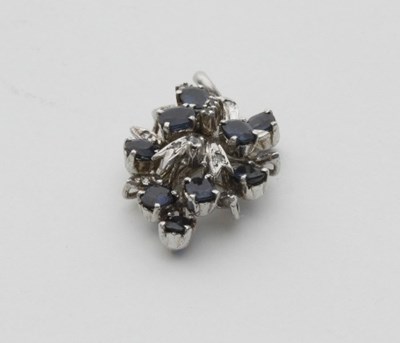 Lot 438 - A sapphire and diamond pendant, of openwork form