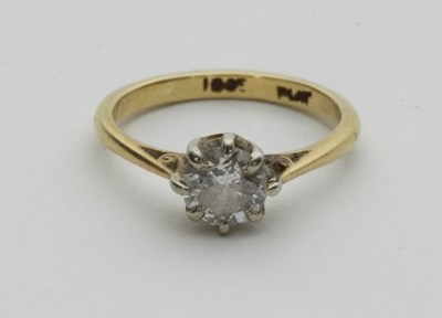 Lot 445 - A diamond solitaire ring, claw set in platinum...