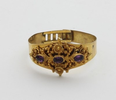 Lot 455 - An amethyst set bracelet, the pierced filigree...