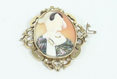 Lot 460 - An oval shell cameo brooch with applied mother...