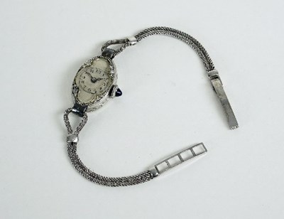 Lot 467 - A diamond set platinum cocktail watch, the...